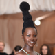 Illustration for article titled Lupita Nyongo Checks iVogue/i for Comparing Her Hairdo to Audrey Hepburns